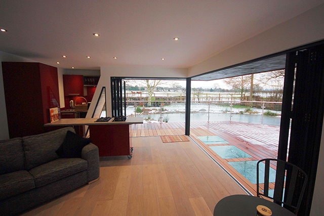 Interior of a garden room using two sets of bi-fold doors 