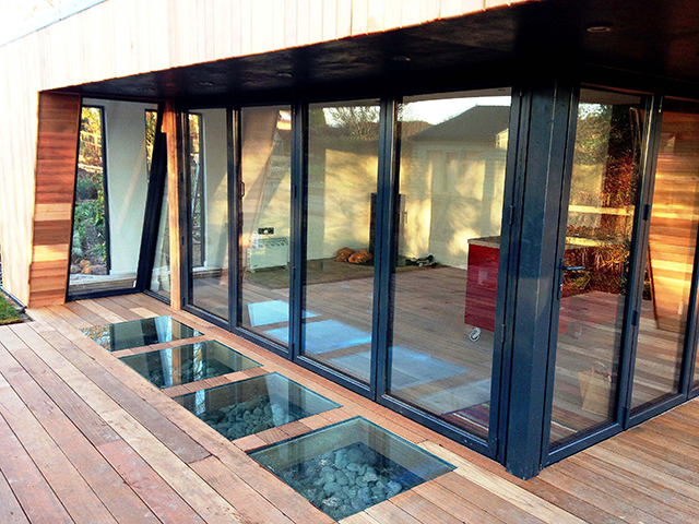 Glass insets in a deck outside a garden room