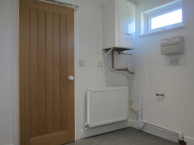 The annexe includes a utility room which houses the boiler with room for washing machine etc