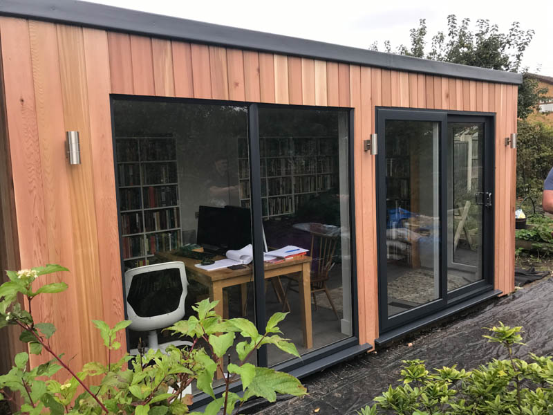 Garden room with two sets of sliding doors on the front elevation