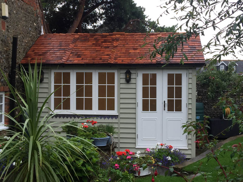 A beautifully tiled cedar shingle roof and traditional detailing