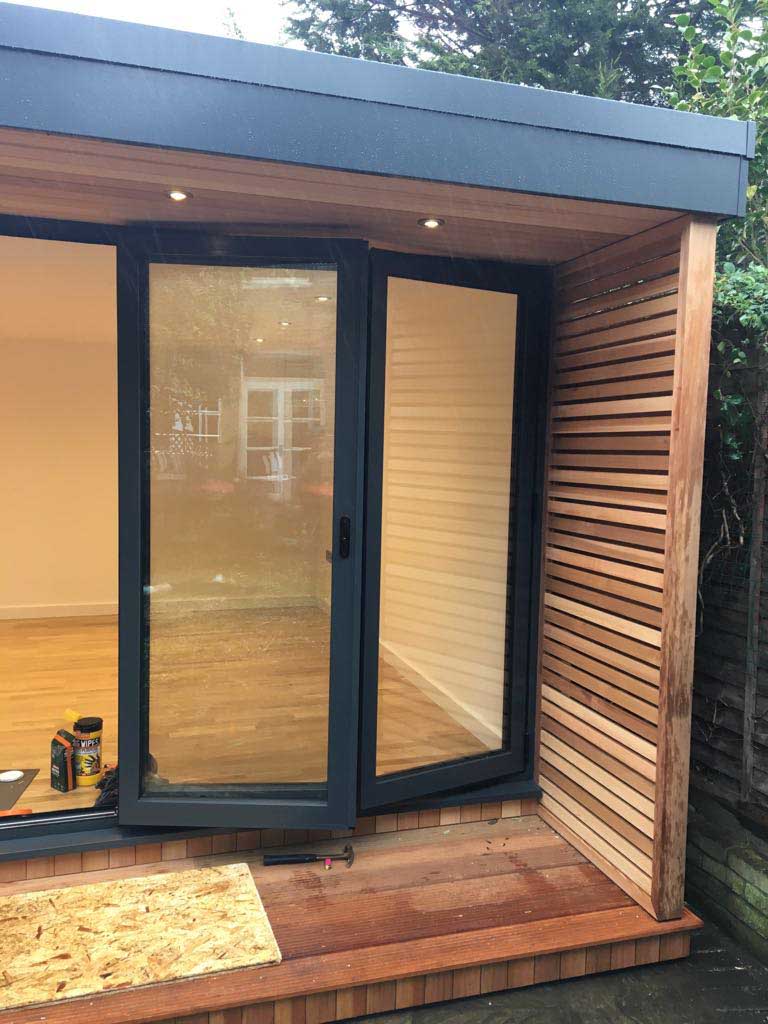 A slatted screen has been fitted beside the bi-fold doors
