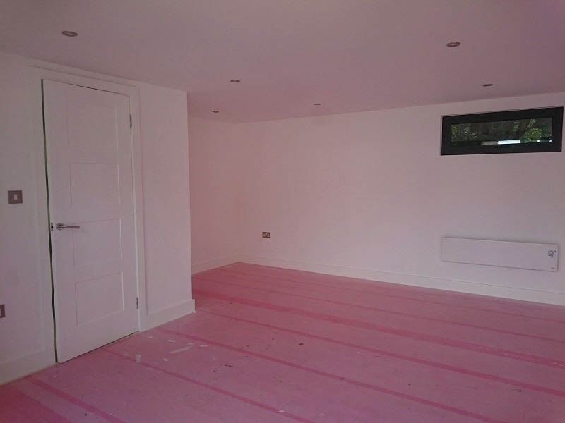 The room has a fully plastered and decorated finish. The customer was fitting the floor themselves
