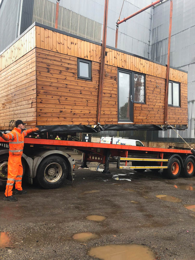 The completed pods are lifted onto the lorry