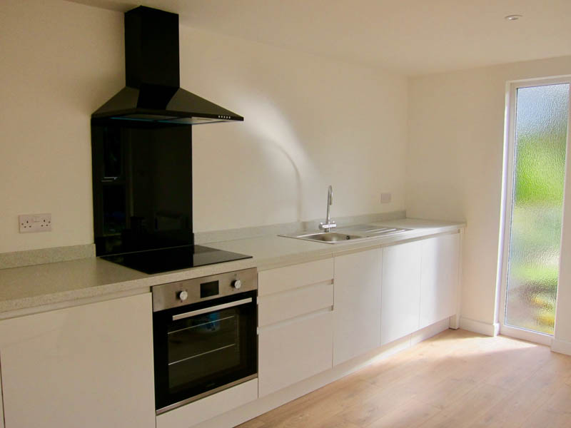The kitchenette includes integrated appliances