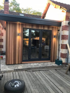 Cedar clad garden room attached to French house