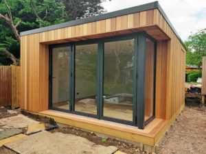 The corner of glazing has been created with bi-fold doors and a fixed window