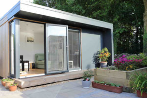 Grey Trespa & Cedar have been mixed together on the exterior of this garden room