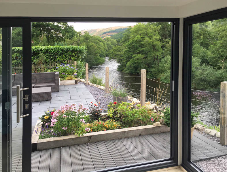 The glazed corner creates a great connection with the garden and frames the wonderful views