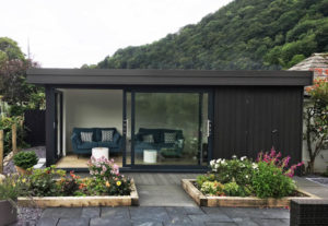The black colour palette has created a striking building, sitting in a beautiful landscape.