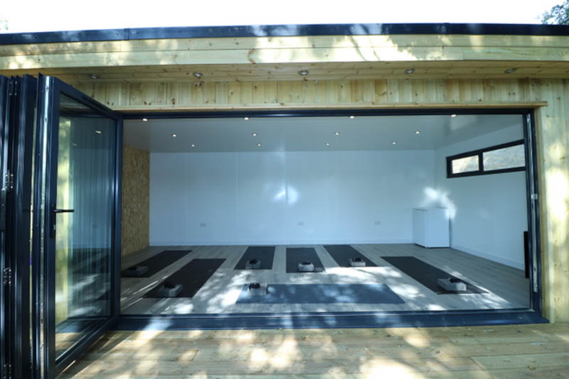 uPVC bi-fold doors enhance the inside outside feel of the yoga studio