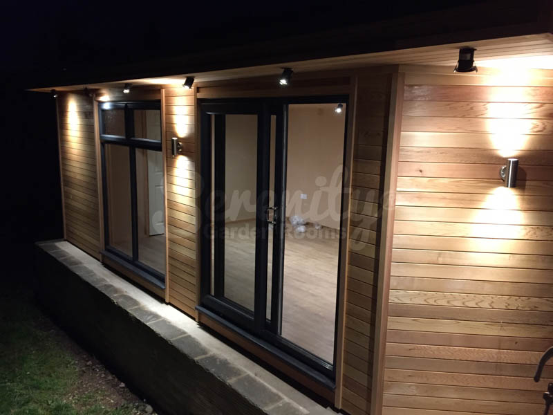 Cedar clad family room. Even at night, you can see the rich reddish/brown of the Cedar