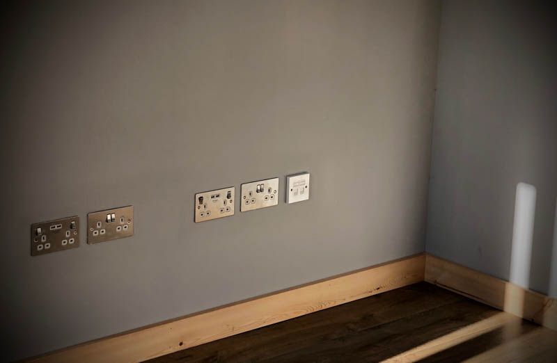Modern brushed steel electrical sockets have been used throughout the office