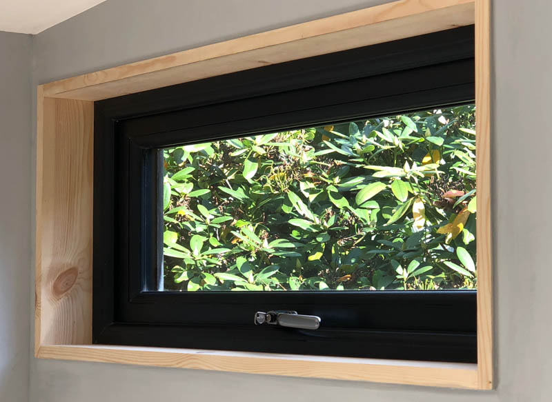 A small window allows for easy ventilation in the office