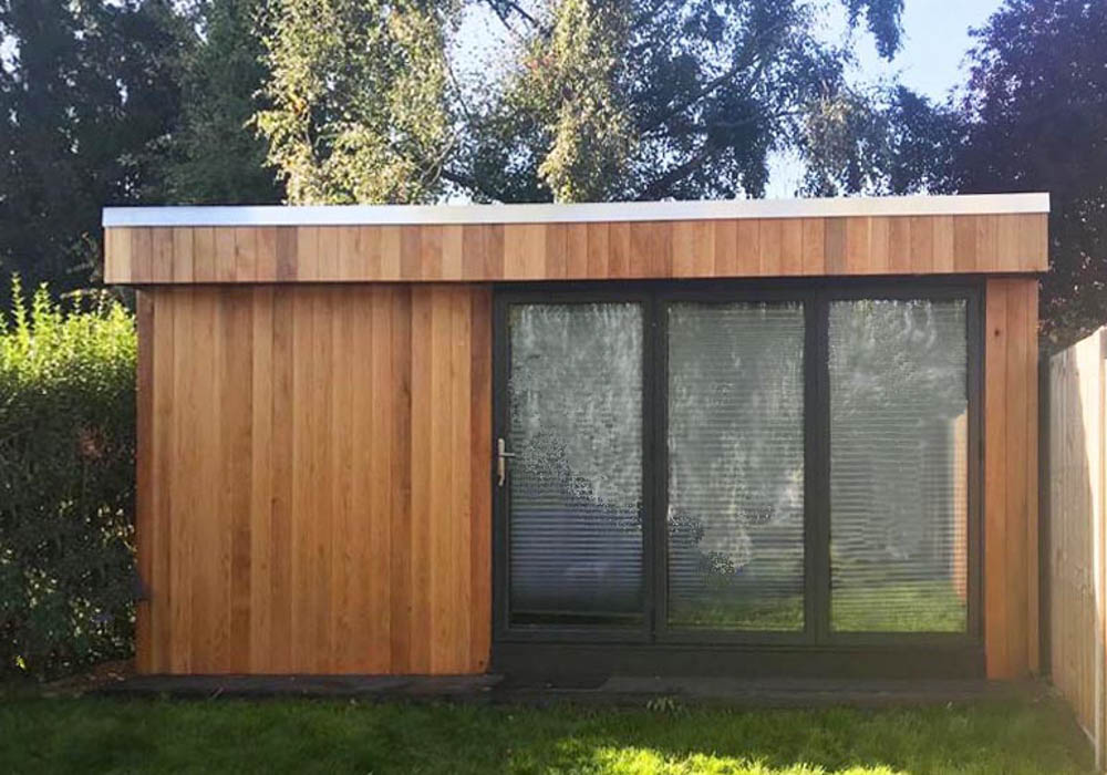 Cedar clad outdoor office with bi-fold doors