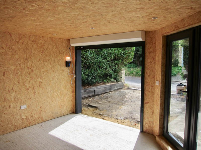 The garage workshop is lined with OSB