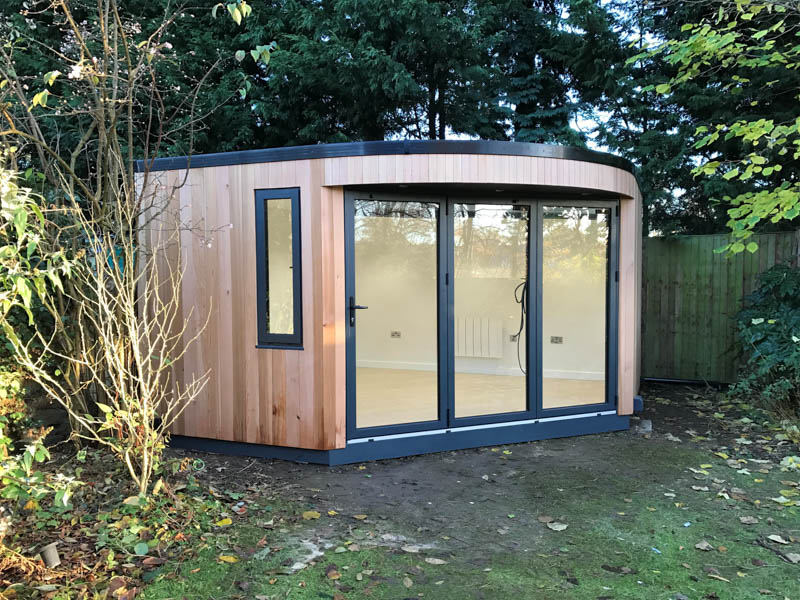 Garden room with curved roof canopy