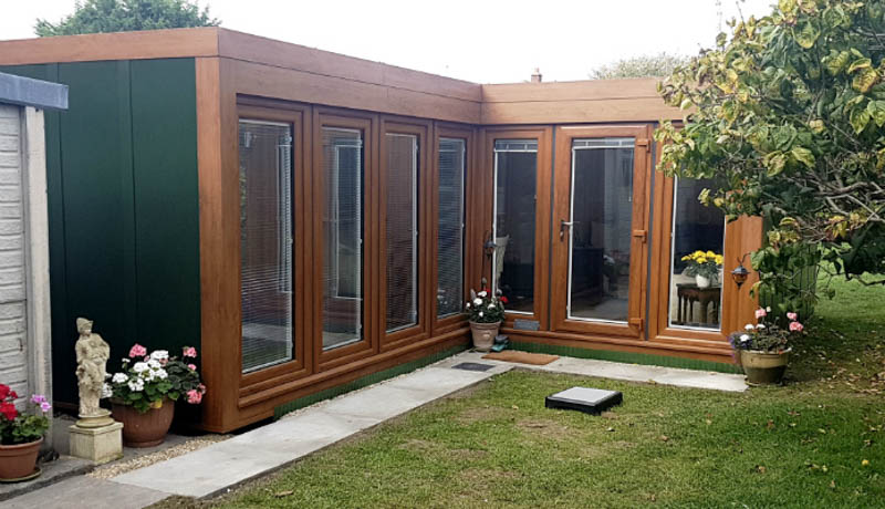 L-shaped granny annexe with walls of glazing