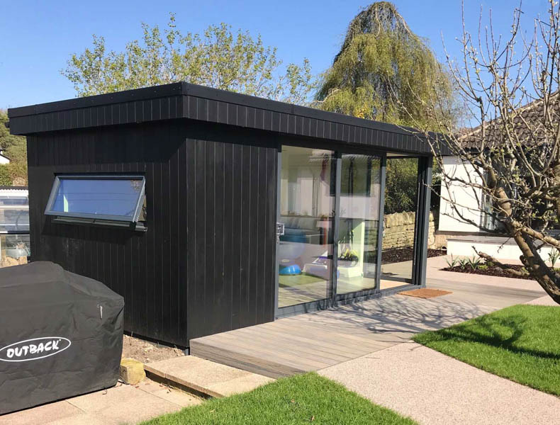 Garden office with black thermowood cladding