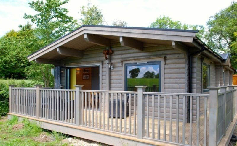 Log cabin home in the garden by Norwegian Log