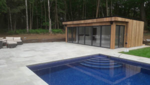 Contemporary style pool house by Bathstone Garden Rooms