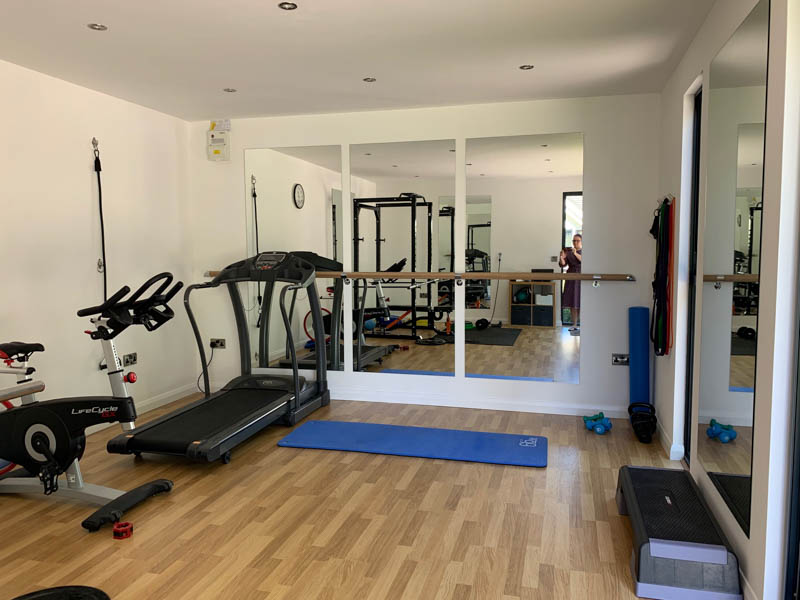 Interior of a home gym garden room by Swift