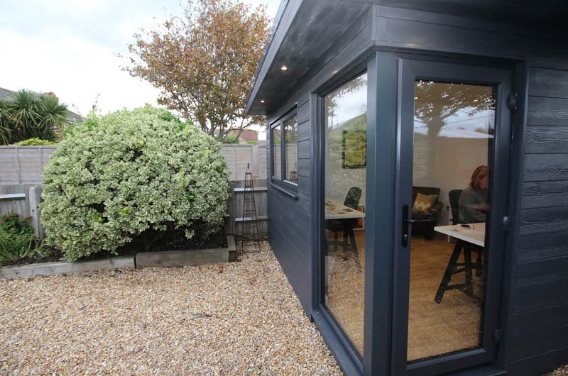 Garden office with dark grey composite cladding by Timber Rooms