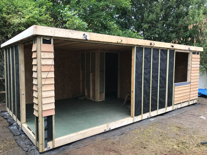 The insulated structure has been clad in Larch feather edge boards