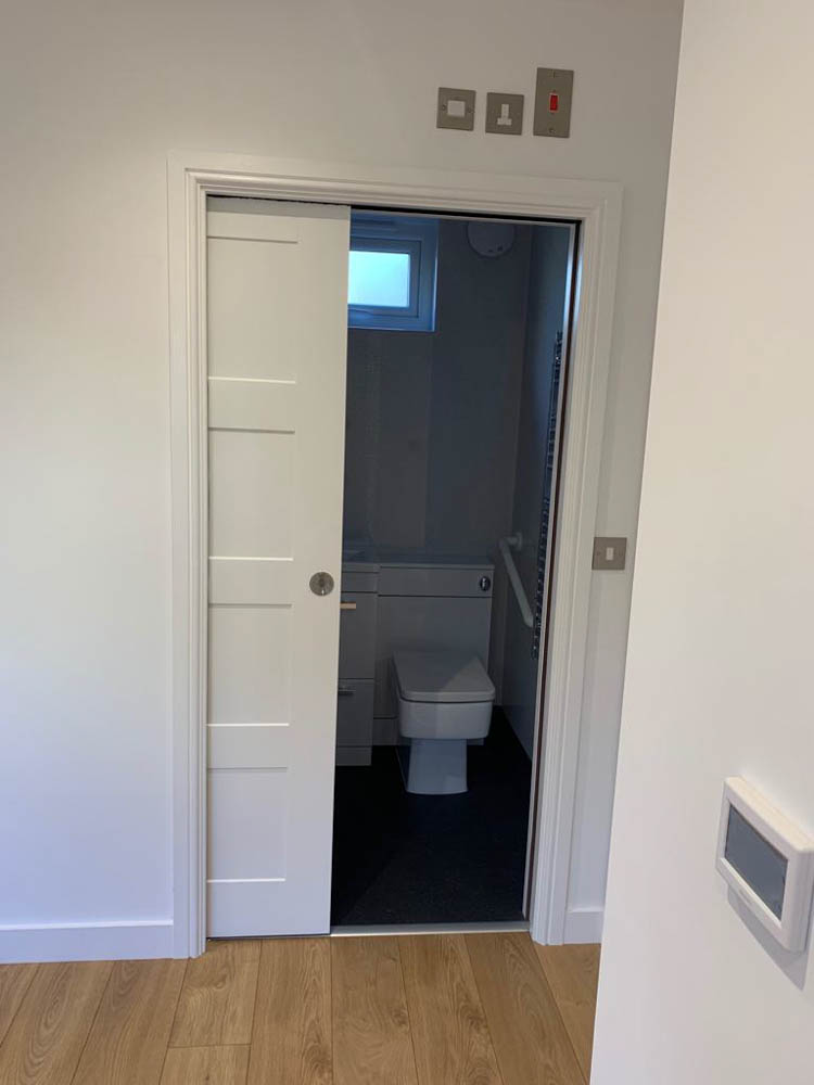 Pocket door into the shower room in an Annexe Space
