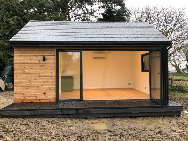 Garden office fitted with aluminium bi-fold doors
