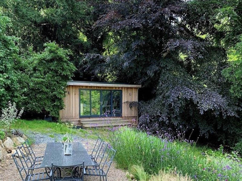 An outdoor room enhances a garden