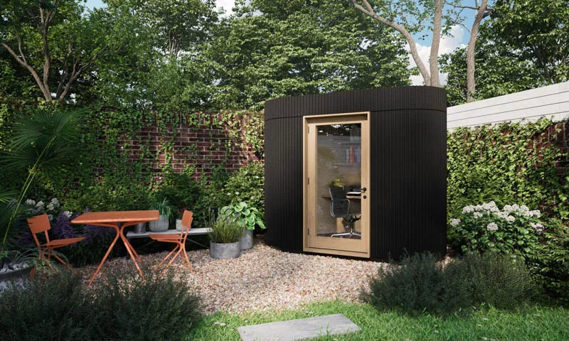 Micro garden office that sits comfortably in the corner of the garden