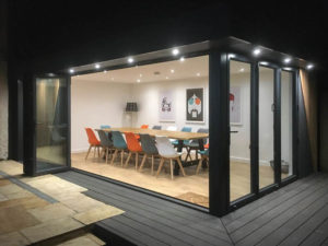 Outdoor entertainment room by Swift at night