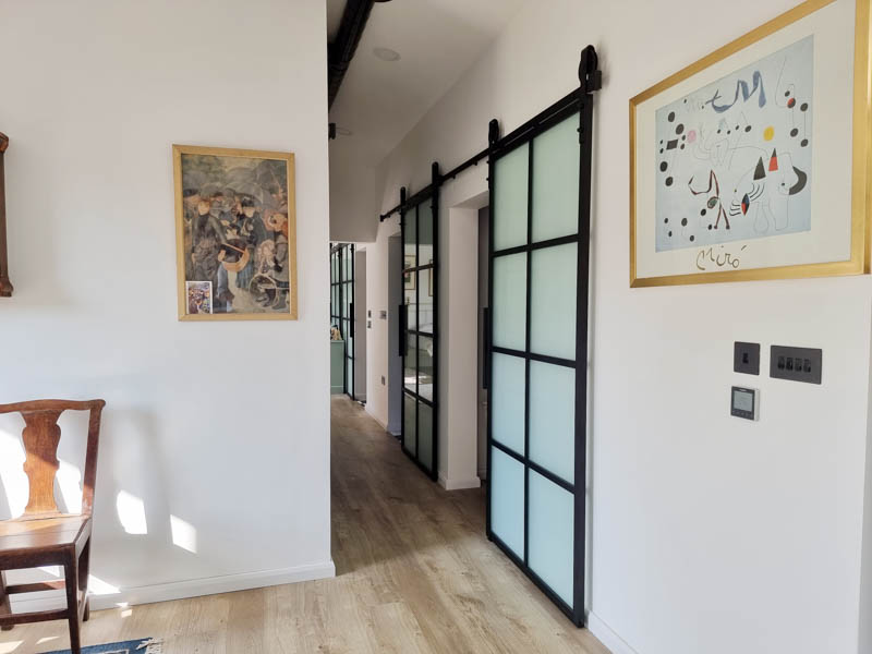 Crittall style sliding doors have been used in this a room in the garden