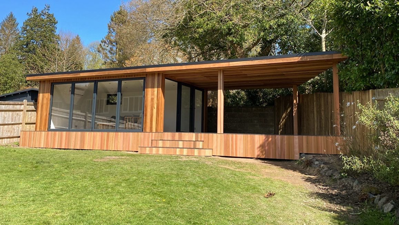 Cedar clad garden room with side canopy by Ark Design Build