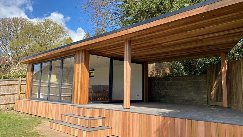A Cedar fascia hides the foundation system used to overcome the sloping site