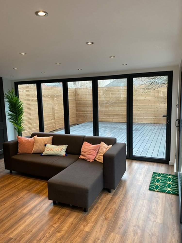 There are bi-fold doors in the main room leading onto a deck