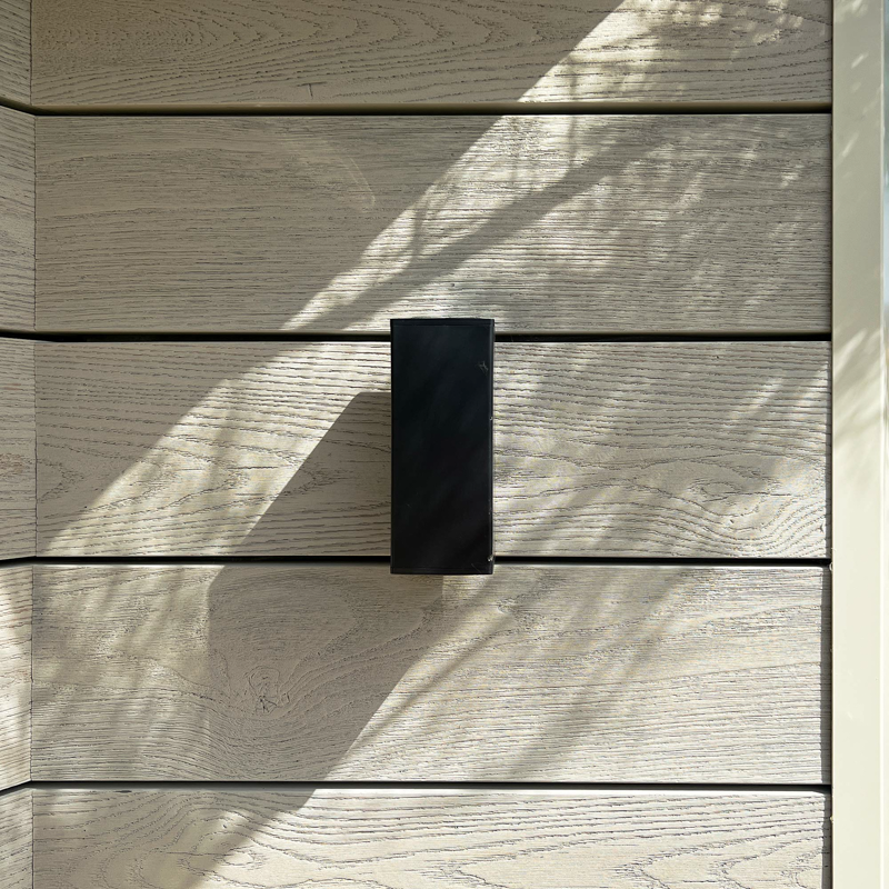 Millboard decking has been used to clad the exterior of the garden room