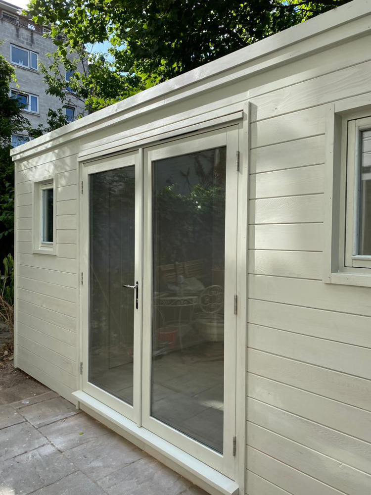 Exterior view of the bespoke Crusoe Garden Room with the French doors shut