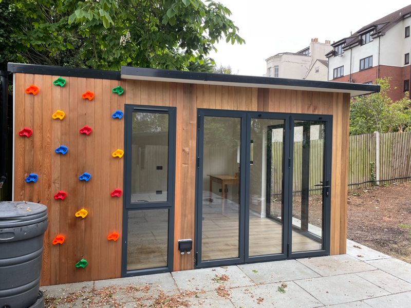 Garden room with climbing wall by Eleven Trees