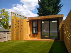 Garden room with climbing wall by Eleven Trees