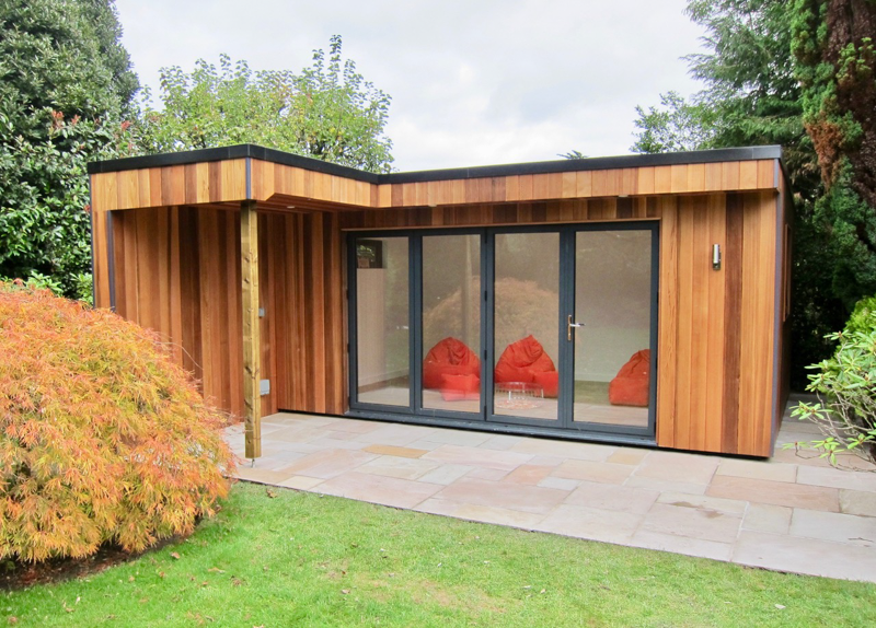 Insulated garden room with canopy for barbecuing