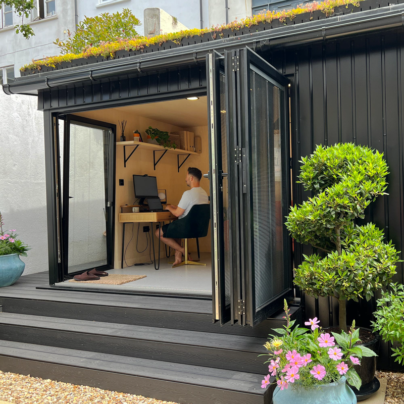Garden office with corrugated cladding by A Room in the Garden