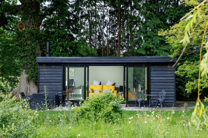 Black clad garden office with sliding doors by Miniature Manors
