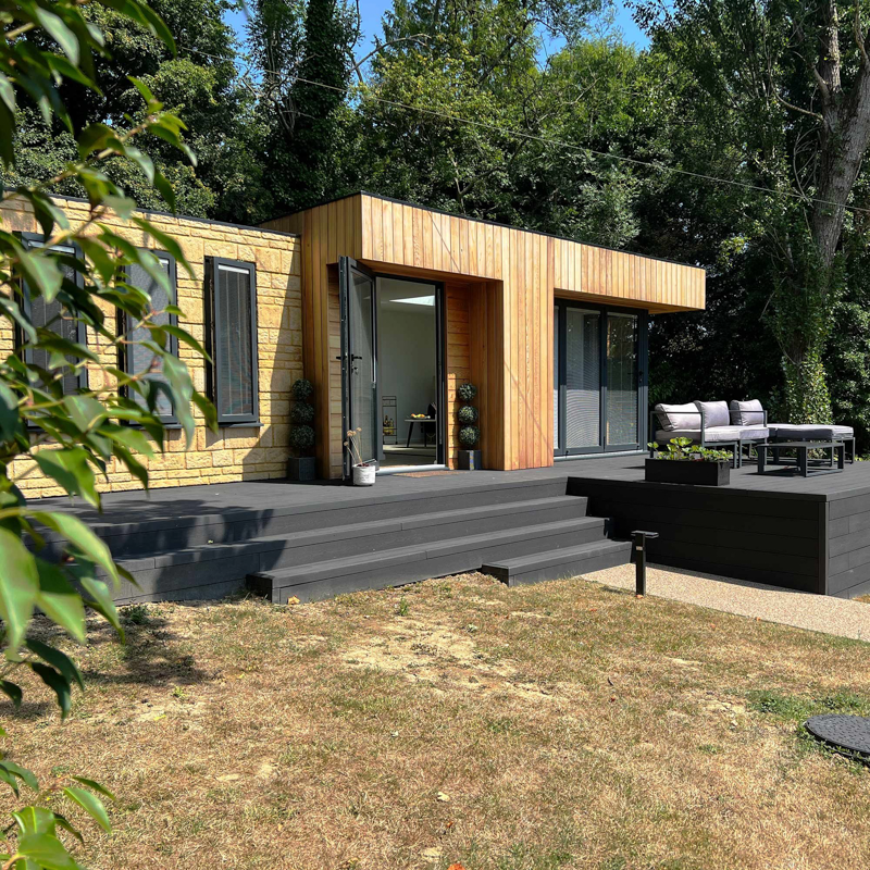 The stone and Cedar cladding has been mixed with composite decking