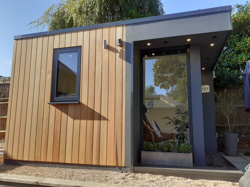 Garden office with a mix of Cedar and cement particle cladding