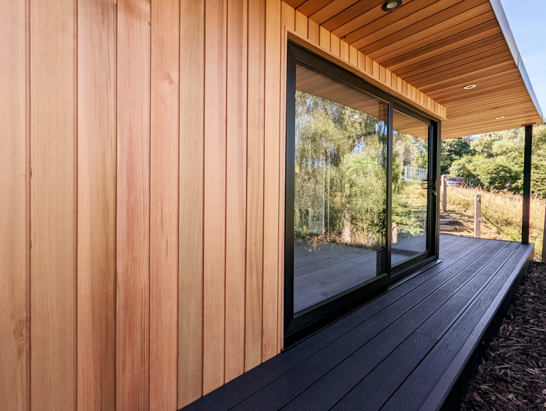 Western Red Cedar has been mixed with black composite decking