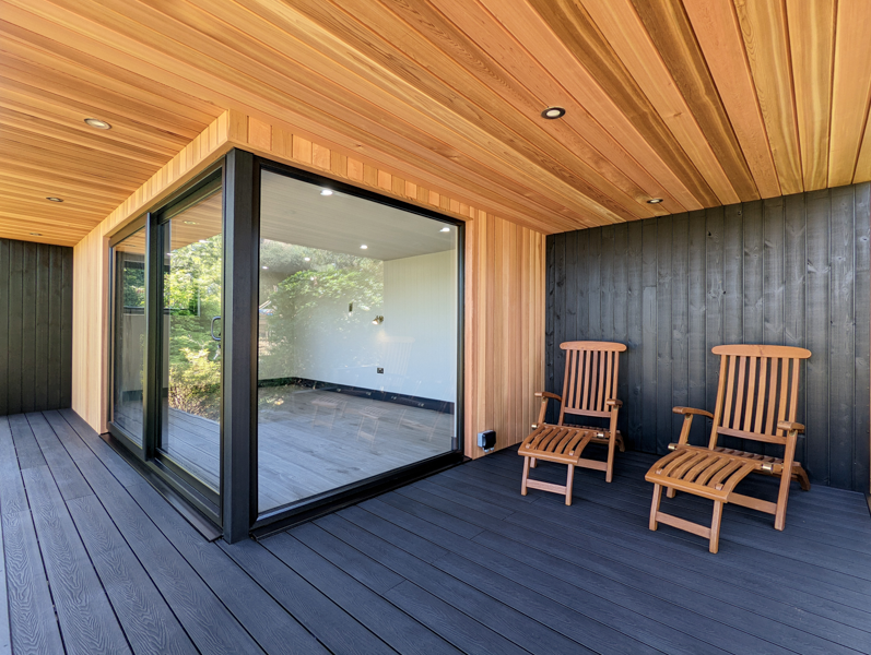 Garden Fortress have mixed Western Red Cedar with burnt Siberian Larch cladding