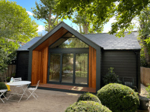 Black & Cedar clad garden room with porch detail