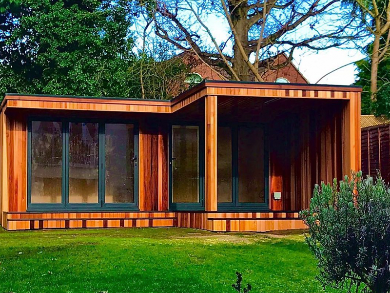 This project by Modern Garden Rooms has the covered seating area in front of the building